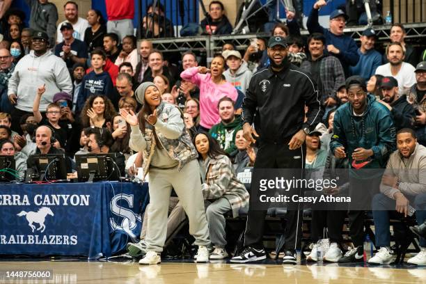 Savannah James and LeBron James cheer court side at the Sierra Canyon vs Christ The King boys basketball game at Sierra Canyon High School on...