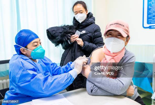 An elderly woman receives a dose of COVID-19 vaccine at a clinic on December 12, 2022 in Hohhot, Inner Mongolia Autonomous Region of China.