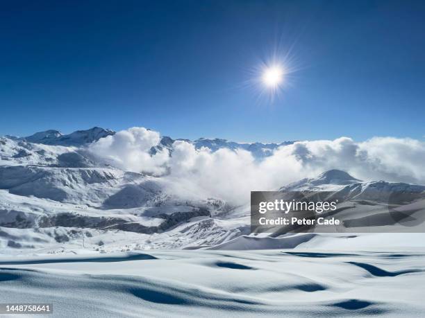 snowy scene french alps - la plagne stock pictures, royalty-free photos & images