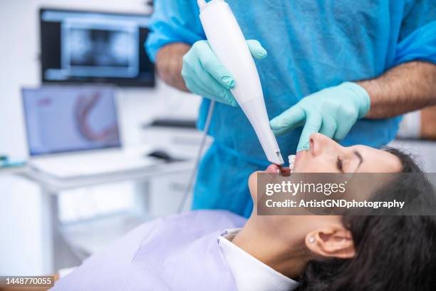 orthodontist scanning patient with dental intraoral scanner. - medical scanning equipment stock pictures, royalty-free photos & images