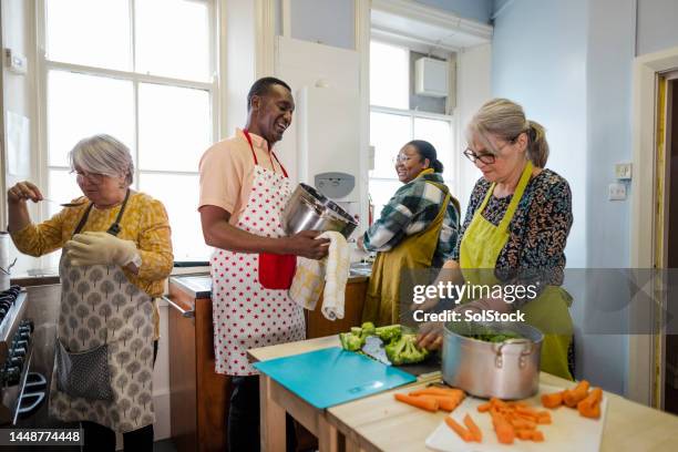 volunteering at a food bank - foodbanks for the needy stock pictures, royalty-free photos & images