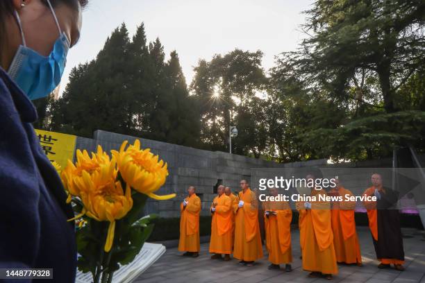 Monks pray during a memorial ceremony for China's National Memorial Day for Nanjing Massacre Victims at the Memorial Hall of the Victims of the...