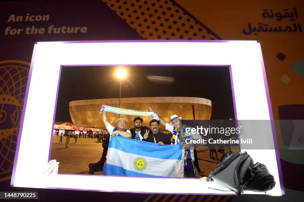 Argentina fans pose for a photo prior to the FIFA World Cup Qatar 2022 semi final match between Argentina and Croatia at Lusail Stadium on December...