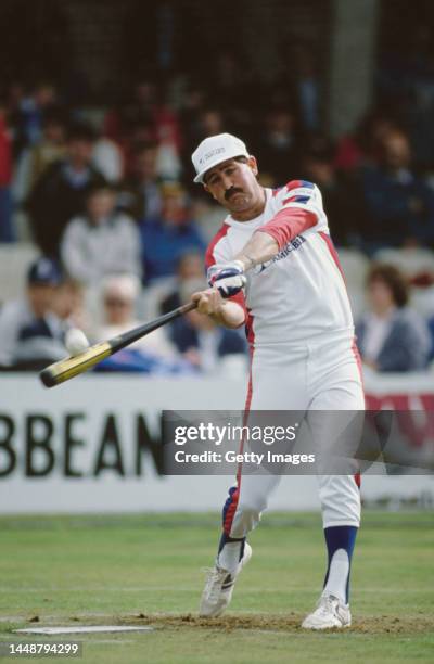 England cricket batsman Graham Gooch tries his hand at batting in Baseball during an event at the Oval Cricket Ground on September 25th, 1988 in...