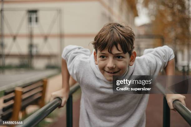 i love to exercise and do pull ups - boys in pullups stockfoto's en -beelden