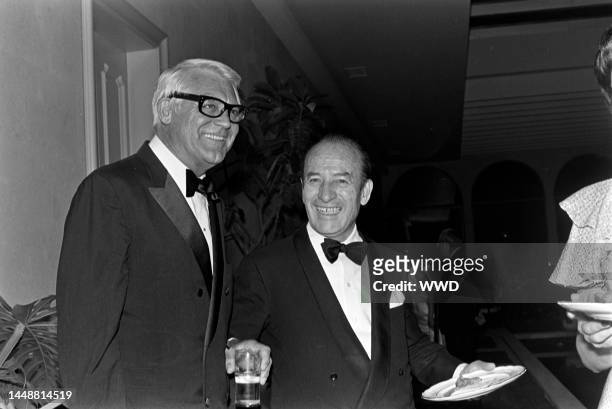 Cary Grant and Bruno Pagliai attend a party for the movie "Interval" in Mexico City on the weekend of March 3-4, 1973.