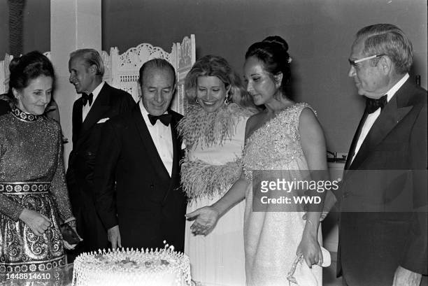 Mary Pagliai , Bruno Pagliai , and Merle Oberon attend a party for the movie "Interval" in Mexico City on the weekend of March 3-4, 1973.