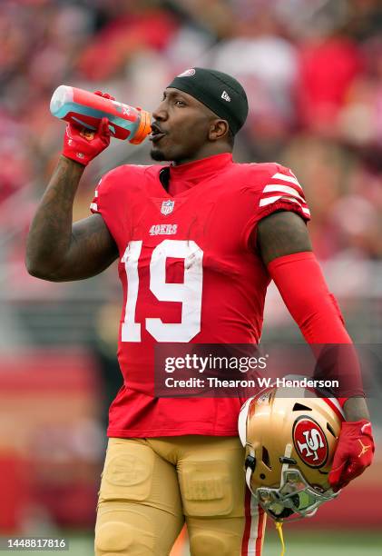 Deebo Samuel of the San Francisco 49ers takes a drink during the first half against the Tampa Bay Buccaneers at Levi's Stadium on December 11, 2022...