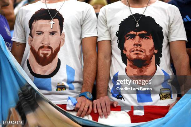 Argentina fans wearing t-shirts with the faces of Lionel Messi and Diego Maradona show their support prior to the FIFA World Cup Qatar 2022 semi...