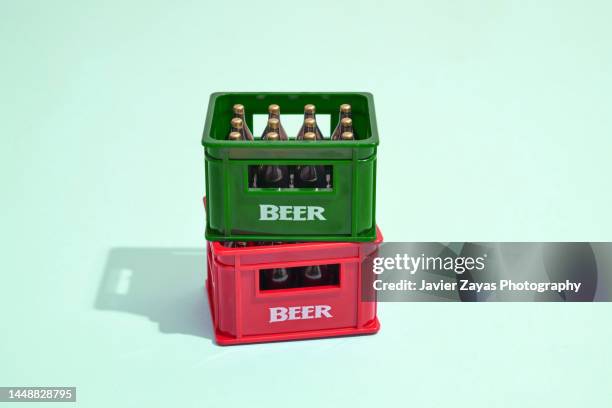 two plastic crates with beer bottles - tappo birra foto e immagini stock