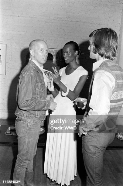 Ryan Johnston and Naomi Sims attend a party in honor of David Hockney, held in the New York City loft apartment of art dealer Michael Findlay, on May...