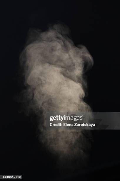 steam on black isolated background - smoking hot ストックフォトと画像