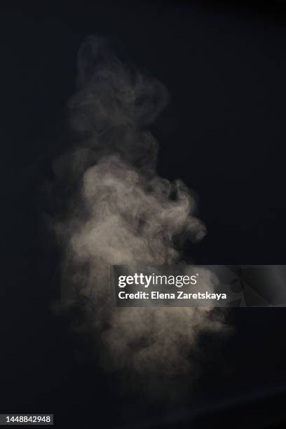 steam on black isolated background - smoke stockfoto's en -beelden