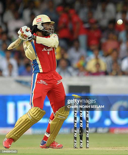 Royal Challengers Bangalore batsman Chris Gayle is bowled by Deccan Chargers bowler Dale Steyn during the IPL Twenty20 cricket match between Deccan...