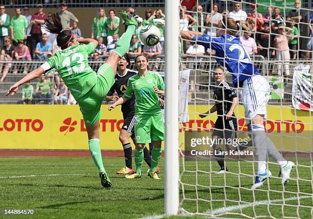 Nadine Kessler of VfL Wolfsburg and goalkeeper Desiree Schumann of 1. FFC Frankfurt vie for the ball during the Women's Bundesliga match between VfL...