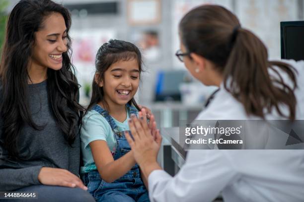 at the doctor with mom - general practitioner stock pictures, royalty-free photos & images