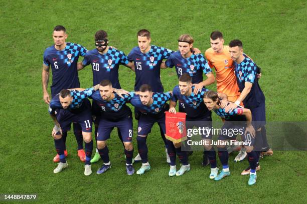 Players of Croatia line up for a team photograph prior to the FIFA World Cup Qatar 2022 semi final match between Argentina and Croatia at Lusail...