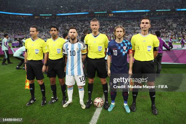 Lionel Messi of Argentina, Referee Daniele Orsato and Luka Modric of Croatia pose for a photo prior to the FIFA World Cup Qatar 2022 semi final match...