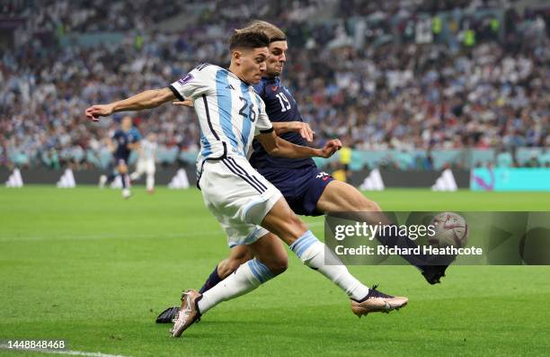 Nahuel Molina of Argentina controls the ball against Borna Sosa of Croatia during the FIFA World Cup Qatar 2022 semi final match between Argentina...