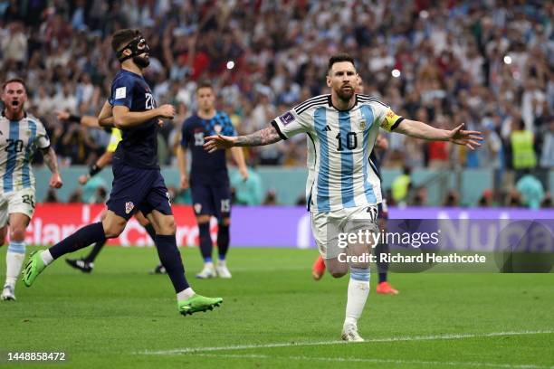 Lionel Messi of Argentina celebrates after scoring the team's first goal during the FIFA World Cup Qatar 2022 semi final match between Argentina and...