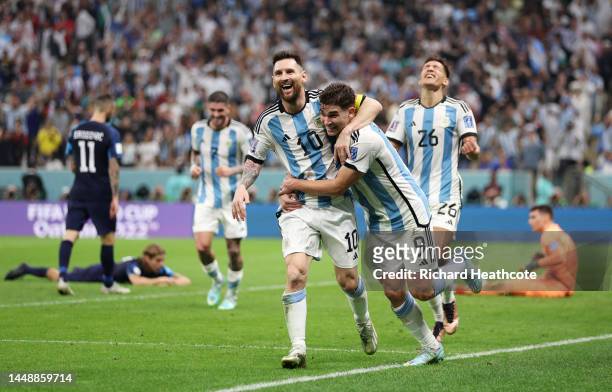 Julian Alvarez celebrates with Lionel Messi of Argentina after scoring the team's second goal during the FIFA World Cup Qatar 2022 semi final match...