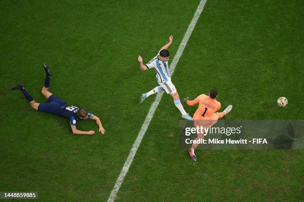 Julian Alvarez of Argentina scores the team's second goal past Dominik Livakovic of Croatia during the FIFA World Cup Qatar 2022 semi final match...