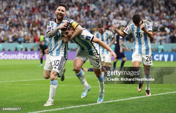 Julian Alvarez celebrates with Lionel Messi of Argentina after scoring the team's second goal during the FIFA World Cup Qatar 2022 semi final match...