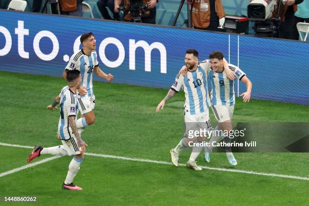 Julian Alvarez of Argentina celebrates with team mate Lionel Messi after scoring their sides second goal during the FIFA World Cup Qatar 2022 semi...