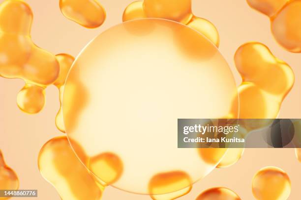 transparent yellow molecules, oil drops and place for text, product on beige background. beauty 3d pattern. cosmetic products for makeup and skin care. collagen. - fish oil ストックフォトと画像