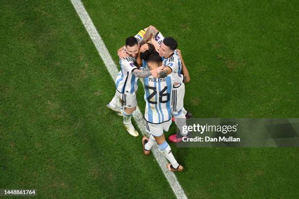 Julian Alvarez of Argentina celebrates with teammate Lionel Messi after scoring their sides second goal during the FIFA World Cup Qatar 2022 semi...