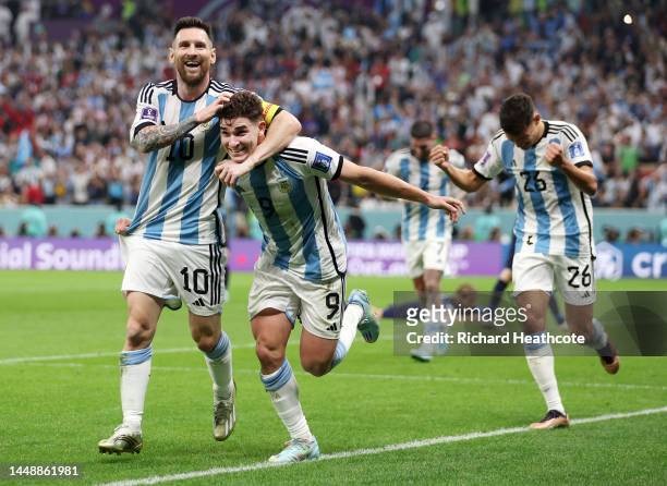 Julian Alvarez of Argentina celebrates with teammate Lionel Messi after scoring their side's second goal during the FIFA World Cup Qatar 2022 semi...