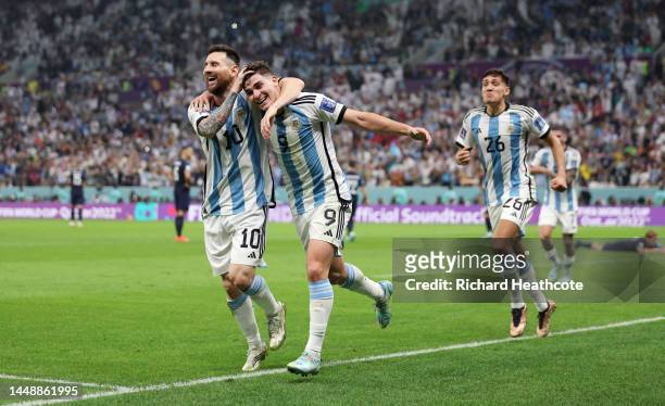 Julian Alvarez of Argentina celebrates with teammate Lionel Messi after scoring their side's second goal during the FIFA World Cup Qatar 2022 semi...