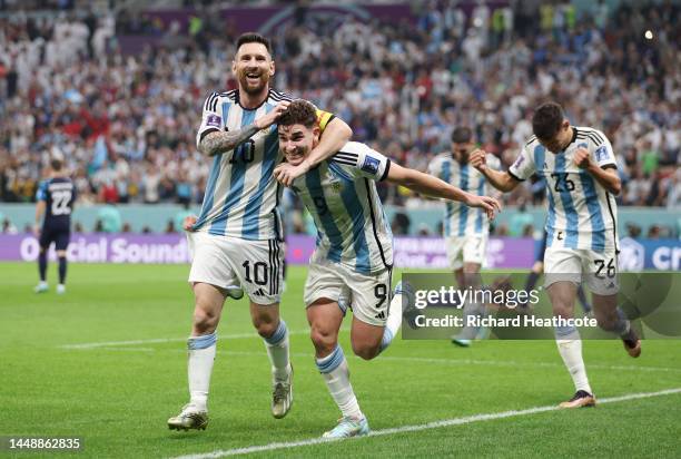 Julian Alvarez of Argentina celebrates with teammate Lionel Messi after scoring their side's second goal during the FIFA World Cup Qatar 2022 semi...