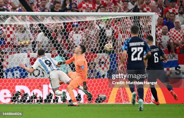 Dominik Livakovic of Croatia fouls Julian Alvarez of Argentina in the box which leads to a penalty during the FIFA World Cup Qatar 2022 semi final...