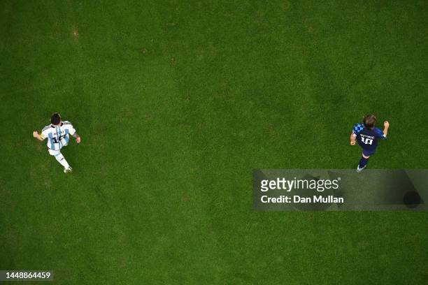 Lionel Messi of Argentina and Luka Modric of Croatia look on during the FIFA World Cup Qatar 2022 semi final match between Argentina and Croatia at...