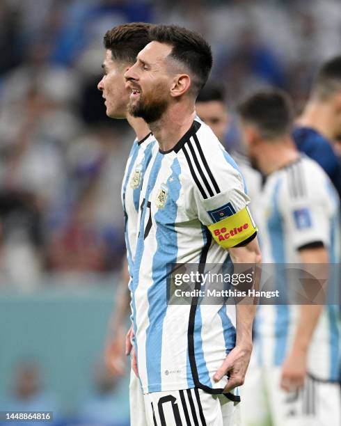 Lionel Messi of Argentina holds his hamstring during the FIFA World Cup Qatar 2022 semi final match between Argentina and Croatia at Lusail Stadium...