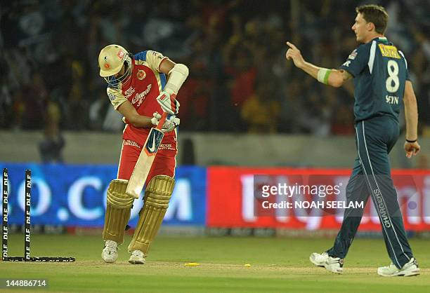 Royal Challengers Bangalore batsman Zaheer Khan looks at his stumps after being bowled by Deccan Chargers bowler Dale Steyn during the IPL Twenty20...