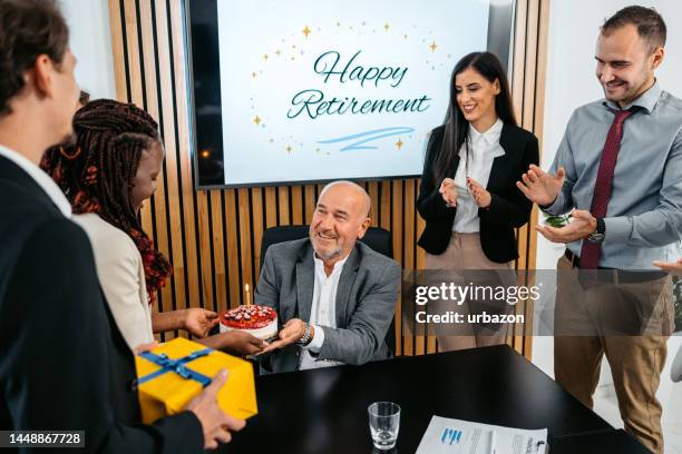 group of people having a retirement party for their colleague at the office - leaving party stock pictures, royalty-free photos & images