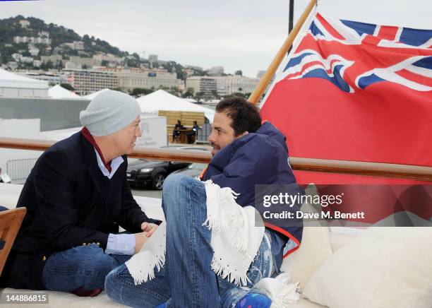 Bryan Lourd and Brett Ratner attend a lunch hosted by Len Blavatnik, Harvey Weinstein and Warner Music during the 65th Cannes Film Festival on board...