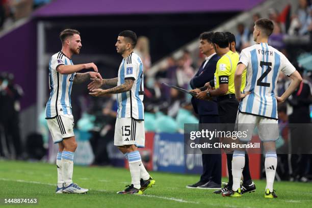 Alexis Mac Allister and Angel Correa of Argentina high five after a substitution during the FIFA World Cup Qatar 2022 semi final match between...