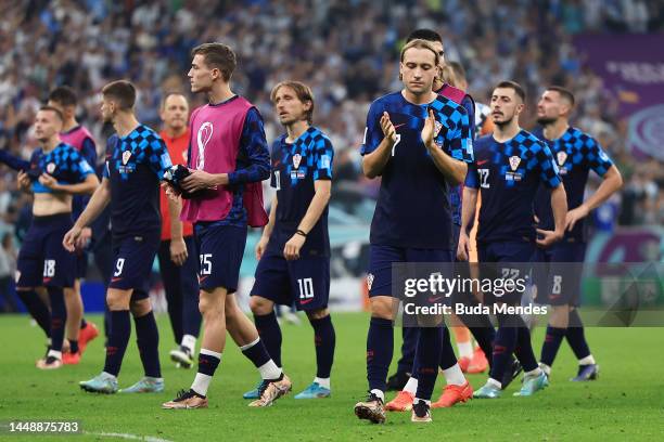 Lovro Majer of Croatia applauds the fans after the team's defeat during the FIFA World Cup Qatar 2022 semi final match between Argentina and Croatia...