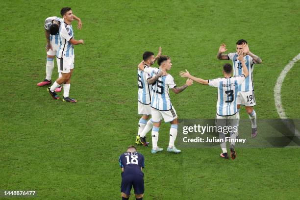 Angel Correa, Lisandro Martinez, Nicolas Tagliafico and Nicolas Otamendi of Argentina celebrate following their sides victory after the FIFA World...