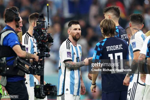 Lionel Messi of Argentina and Luka Modric of Croatia shake hands after the FIFA World Cup Qatar 2022 semi final match between Argentina and Croatia...