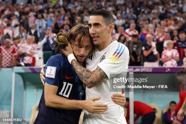 Luka Modric of Croatia is consoled by Angel Di Maria of Argentina after the FIFA World Cup Qatar 2022 semi final match between Argentina and Croatia...