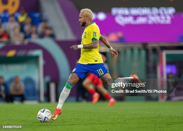 Neymar of Brazil dribbles during a FIFA World Cup Qatar 2022 Round of 16 game between Korea Republic and Brazil at Stadium 974 on December 5, 2022 in...