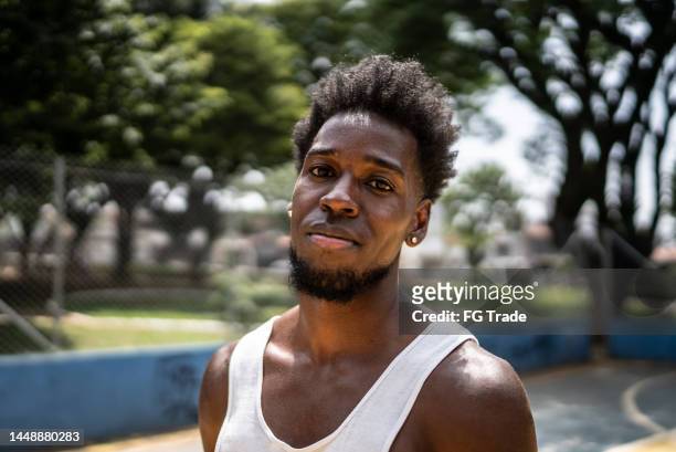 portrait of a young man in a sports court - man goatee stock pictures, royalty-free photos & images