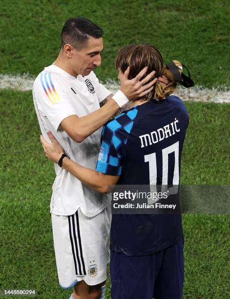 Angel Di Maria of Argentina interacts with Luka Modric of Croatia after the FIFA World Cup Qatar 2022 semi final match between Argentina and Croatia...