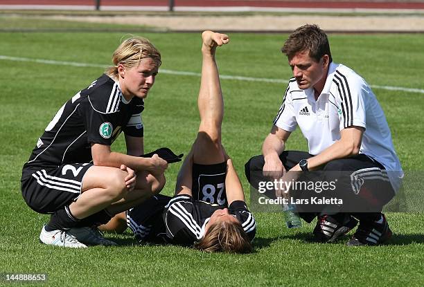 Saskia Bartusiak of 1. FFC Frankfurt and Sandra Smisek react after the Women's Bundesliga match between VfL Wolfsburg and 1. FFC Frankfurt at Stadion...