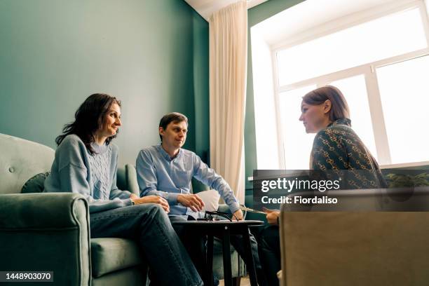 three persons talking in the office - emotional support at work stock pictures, royalty-free photos & images