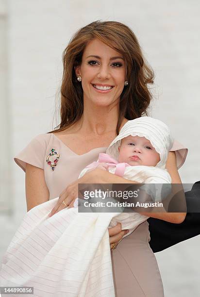 Princess Marie of Denmark and Princess Athena attend the christening of Princess Athena of Denmark at the chrurchyard of Mogeltonder Church on May...